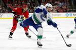 Williams' shootout goal lifts Hurricanes past Canucks, 4-3