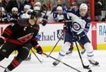 Jets rout Hurricanes 8-1 to take Central Division lead